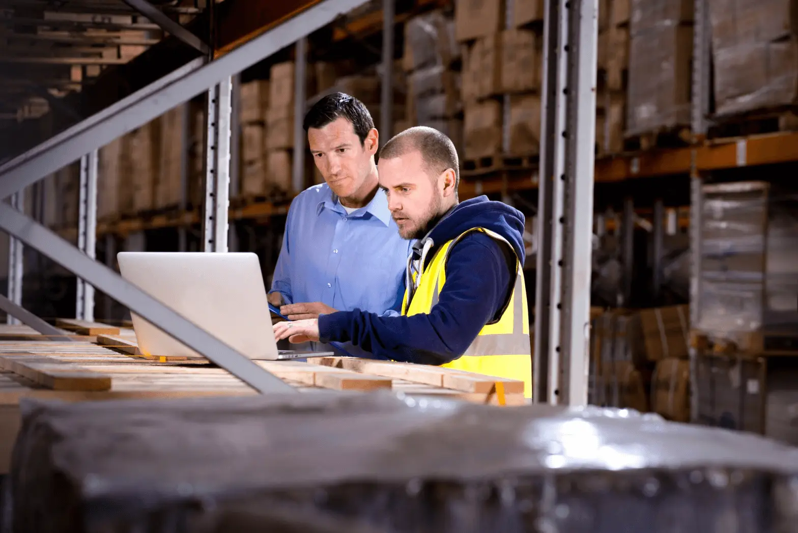 Warehouse workers on laptop