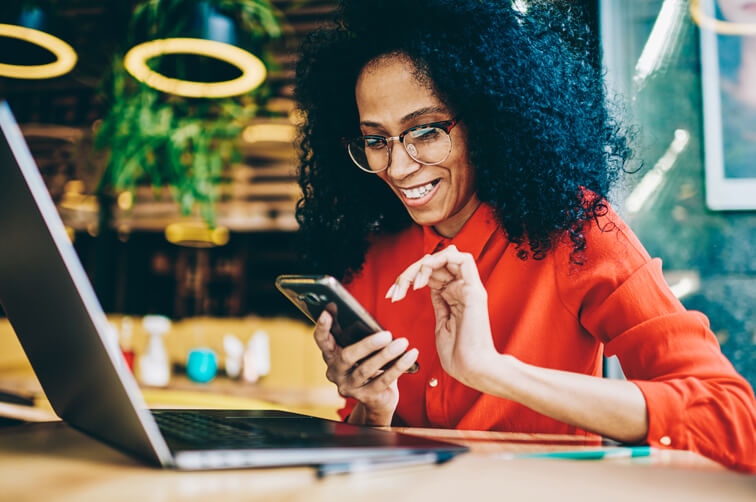 Woman using mobile device in cafe