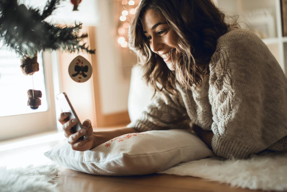 Woman on phone at Christmas