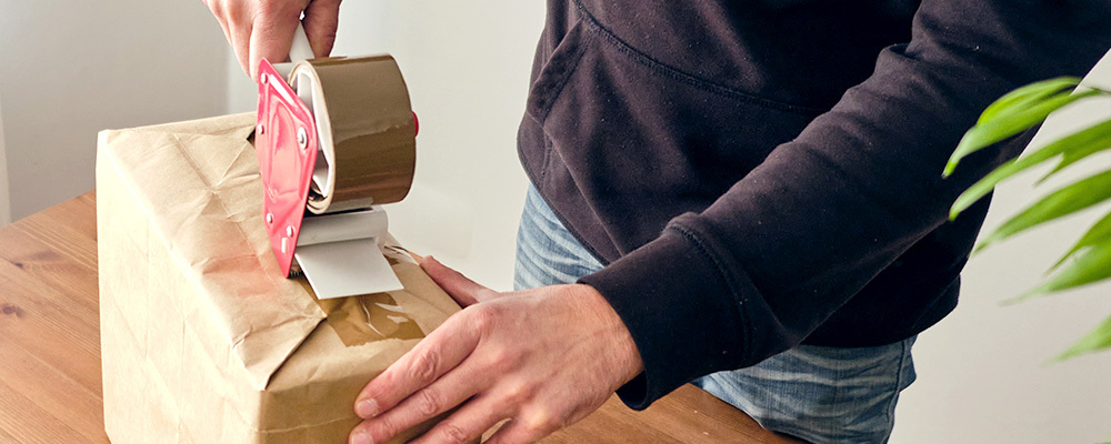 Man boxing up parcel